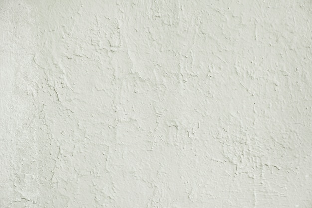 Old white cracked painted wall background texture