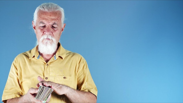 Old White Haired Man is Counting Money Photo