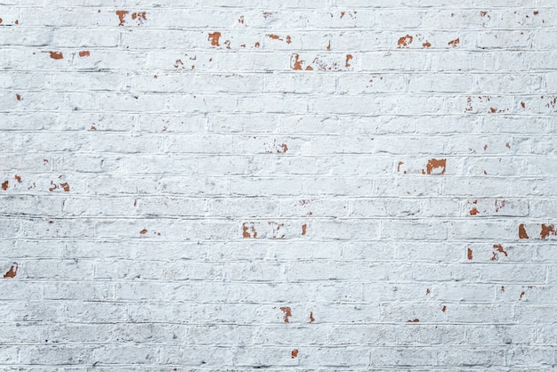 Old white seamless brick wall pattern background. Vintage texture of light brickwork.