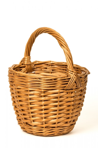 Photo old wicker basket on a white