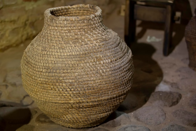 Old wicker vine container jug for wine.