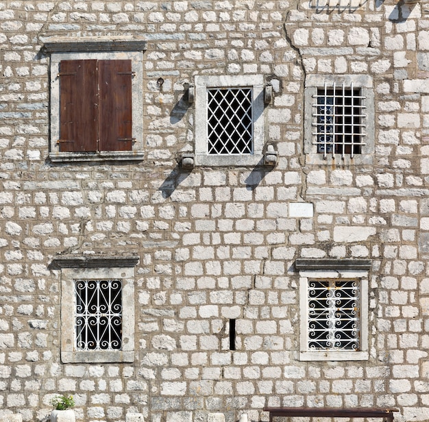 old windows in a stone wall