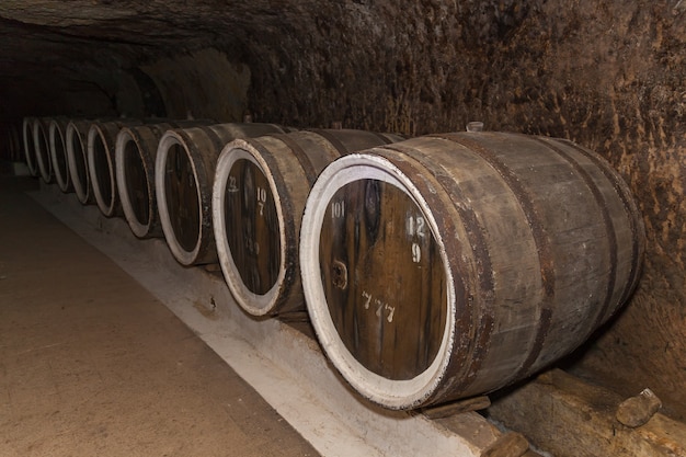 An old wine cellar with oak barrels,barrels for wine in old cellars