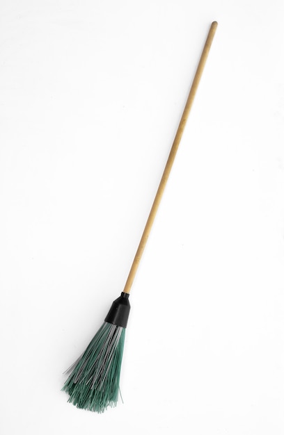Photo old witchs broom isolated on white background