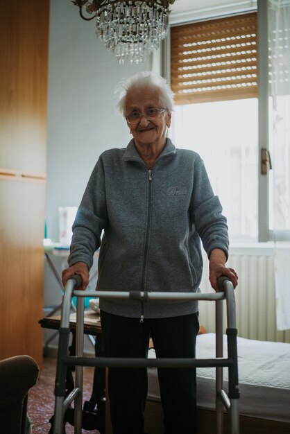 Old woman alone in her room. 95 years old grandmother thinking about her life and memories