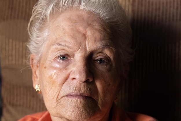 Old woman crying tears of sadness, grief and pain because to\
loneliness and abandonment