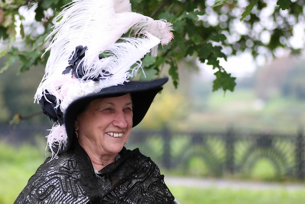 Old woman hat feather