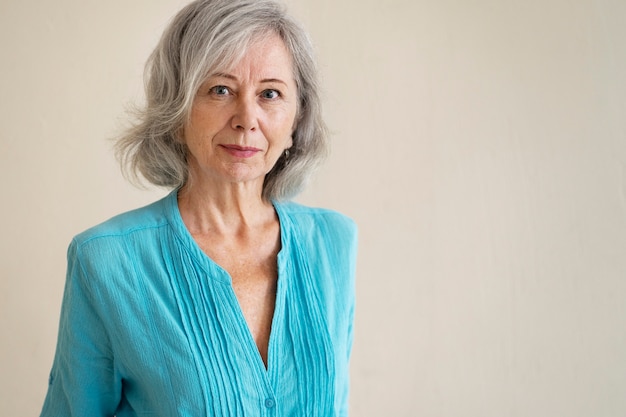 Old woman posing indoors medium shot