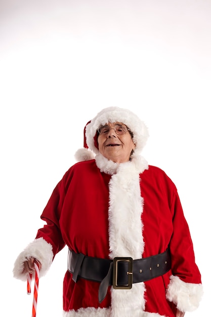 An old woman in a Santa Claus costume looking up at the sky