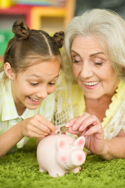 Old woman with piggy bank