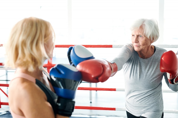 Old women on boxing ring