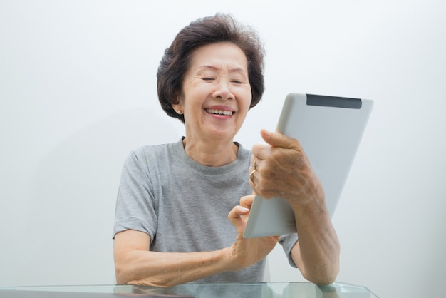 Old women with tablet,Senior Woman 