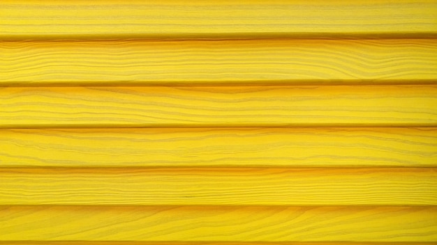 Foto vecchia struttura di recinzione in legno vernice in colore giallo cornice sfondo texture legno giallo