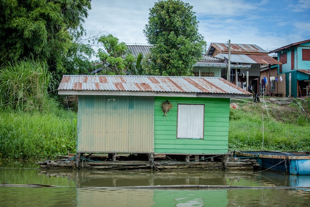 old wood house on river