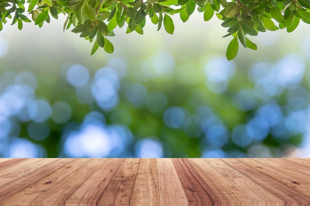 Old wood plank with abstract natural green blurred bokeh background 