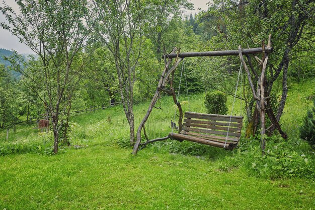 Old wood swing in garden