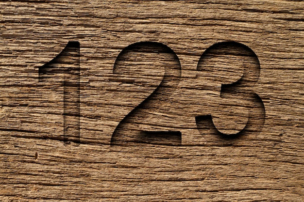 Old wood texture with the numbers one two and three engravedold wood texture with the numbers one two and three engraved