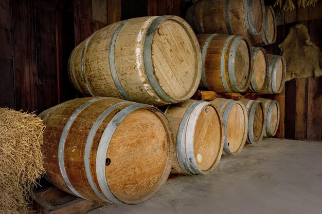 old wooden barrels stacked in winery