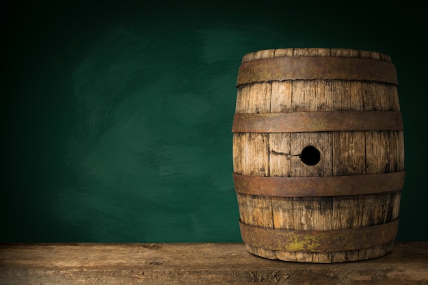 Old Wooden Beer Barrel on the Dark Background