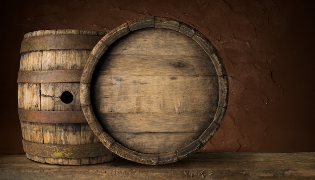 Old Wooden Beer Barrel on the Dark Background