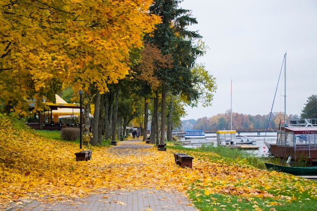 Old wooden boats near the beach of Trakai Gavle lake , Lithuania. Autumn and fall time.