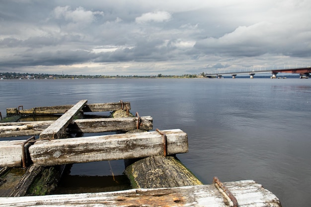 Old wooden bridge on the river