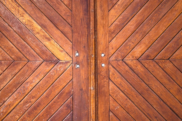 Old wooden brown house door in Ukraine.