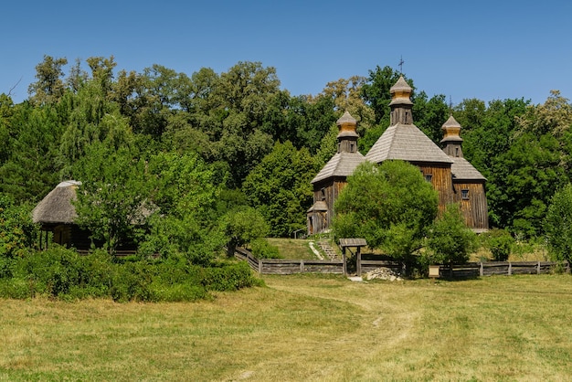 Old wooden church on a background of blue sky