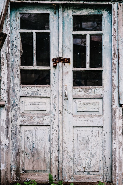 Old wooden door closed on the lock