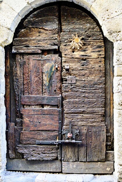 Old wooden door of a house in the town of Besalu Girona Spain