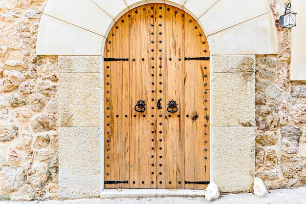 Old wooden door of a house in the village of Valldemossa Mallorca Balearic Islands Spain