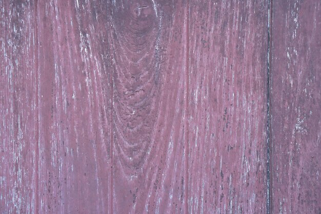 The old wooden floor has a pattern of decay