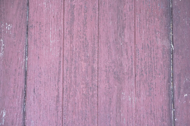 The old wooden floor has a pattern of decay