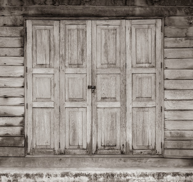 Old wooden house door with lock  