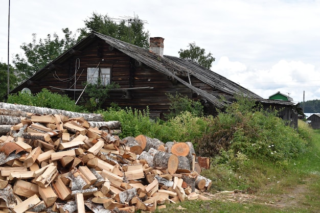 Old wooden house in the village in forest rural peaceful landscape