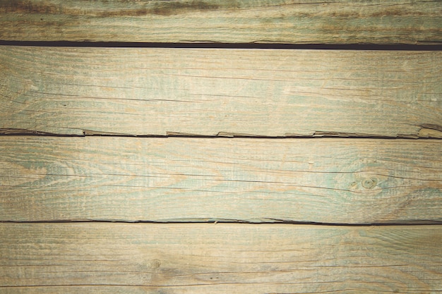 Vecchie tavole di legno tavole con rilievi incrinati e residui di vernice texture di legno vecchio.