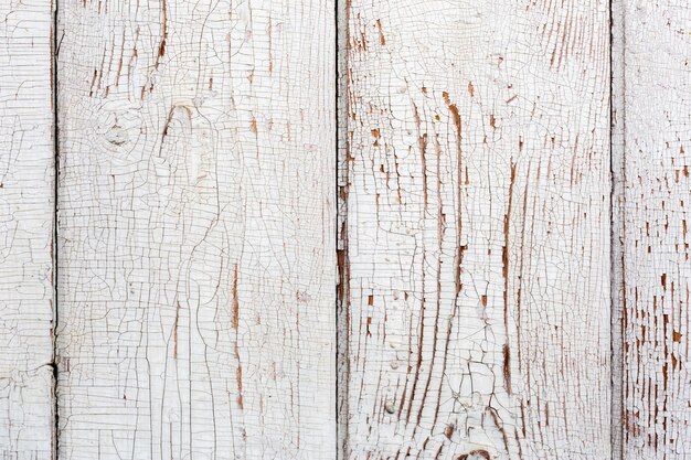 Old wooden planks painted into white closeup background