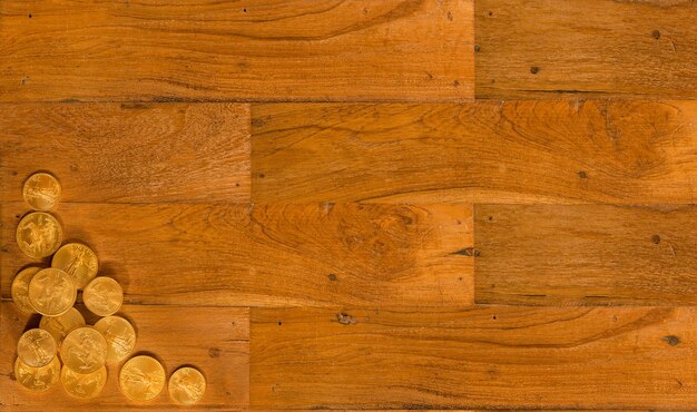 Old wooden planks with gold coins background