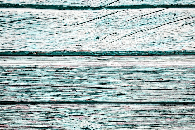 Old wooden planks with peeling paint. Old board. effect of weather on wood.