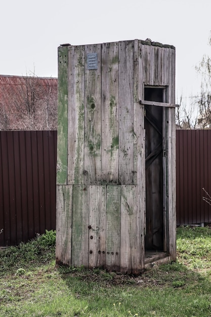 Old wooden rustic toilet in nature