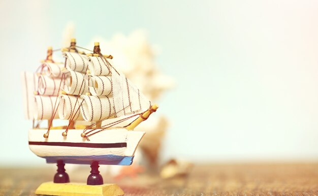 old wooden ship with sails and masts toy on a stand. vintage and retro toys