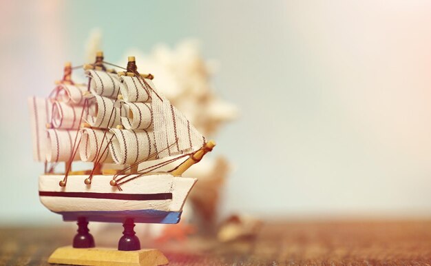 old wooden ship with sails and masts toy on a stand. vintage and retro toys