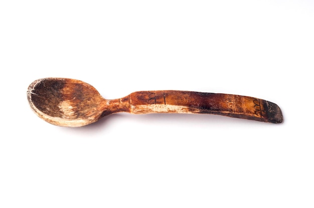 old wooden spoon isolated on white background