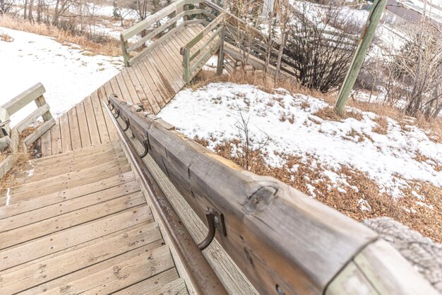 Old Wooden staircase walkway in city with railing