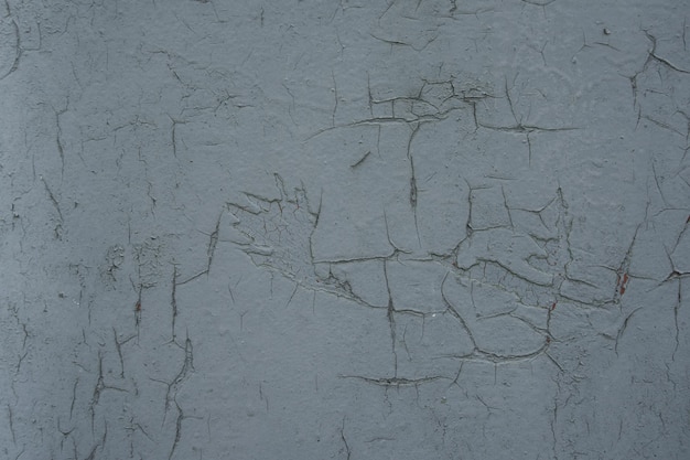 old wooden surface, painted with white paint. over time, paint peeled off and lost color. close-up