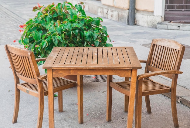 old wooden table and chairs on the street