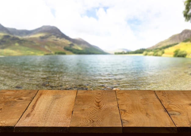 Old wooden table or walkway by lake