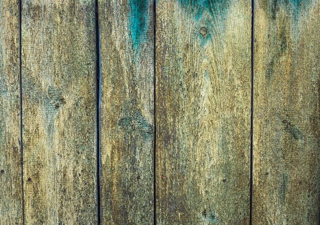 Old wooden wall with cracked paint, background texture. High quality photo