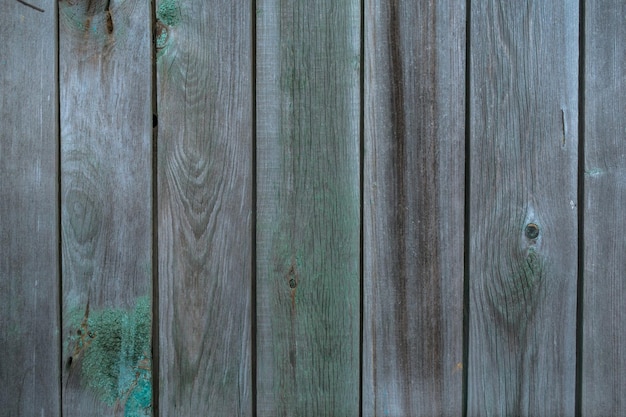 old wooden wall with faded paint