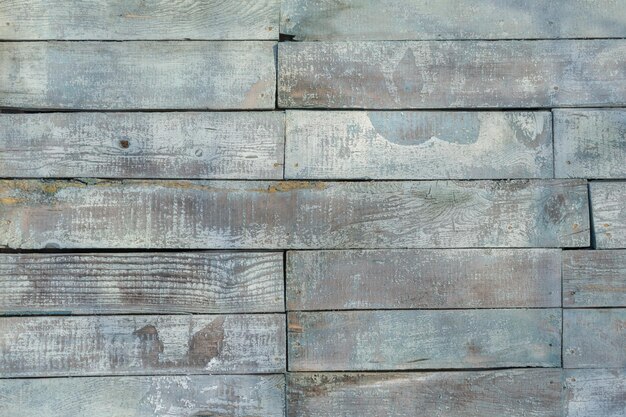 old wooden wall with faded paint